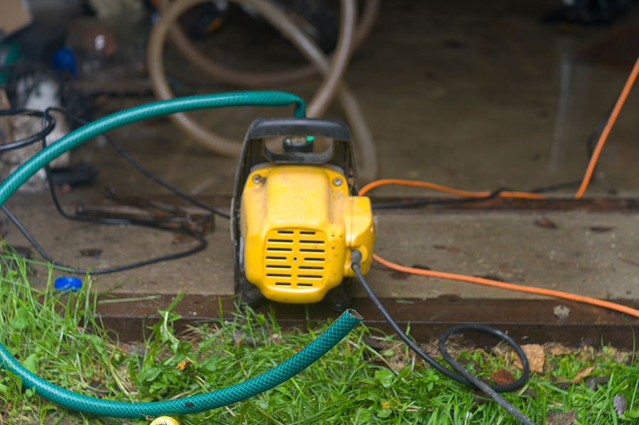 Water remediation treatment - electric pump removing excess water from home - Belleville, IL